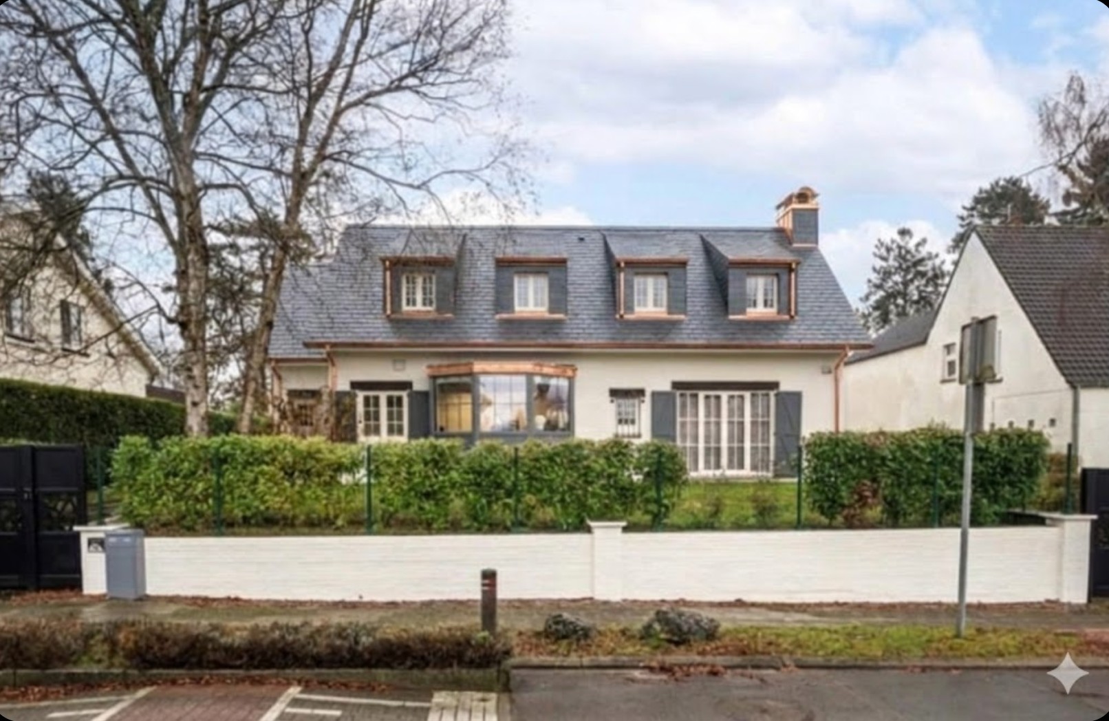 Dakrenovatie met leien en koper in Waterloo